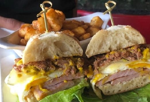 Breakfast Cuban Sandwich with breakfast potatoes at Symposium Restaurant Guelph