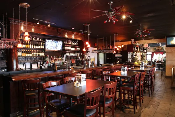 Guelph bar and lounge with comfortable seating, warm lighting and a relaxed atmosphere near Stone Road Mall.