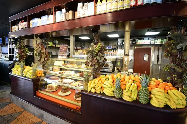 Symposium Cafe Restaurant Georgetown dining room with warm décor and comfortable seating for family meals.