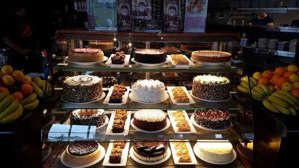 Lindsay dessert showcase filled with rich cakes, creamy cheesecakes and indulgent chocolate desserts.