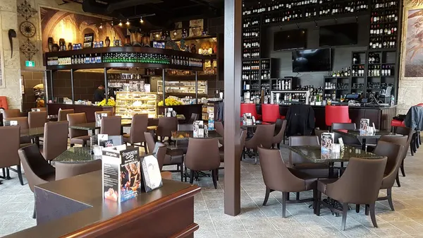 Symposium Cafe Restaurant Lindsay dining room with relaxed upscale-casual décor and comfortable seating.