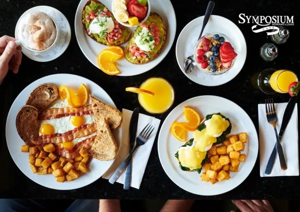 Alliston signature brunch with Eggs Benedict, fresh fruit and a refreshing mimosa.