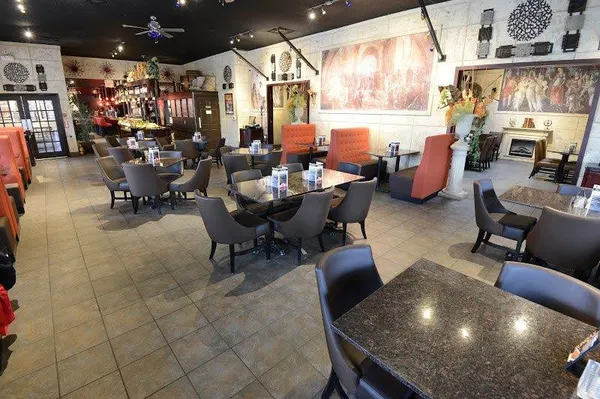Guelph dining room with Renaissance-inspired frescoes, warm lighting and relaxed upscale-casual décor.
