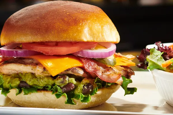 Ontario gourmet lunch favourite with California chicken sandwich, fresh toppings and side salad.