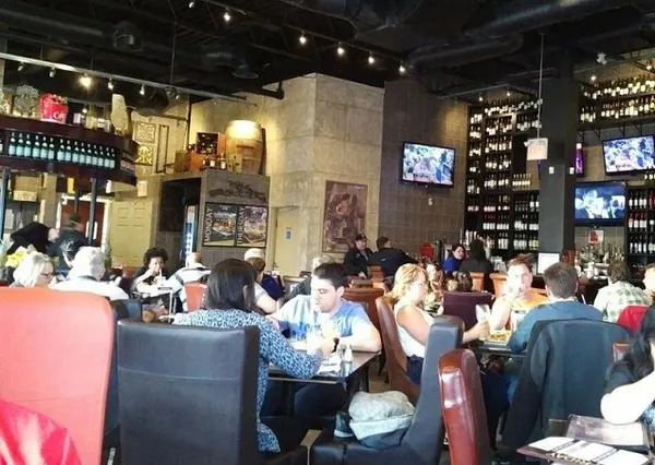 Warm Barrie restaurant dining room with comfortable seating, soft lighting and relaxed upscale-casual décor.