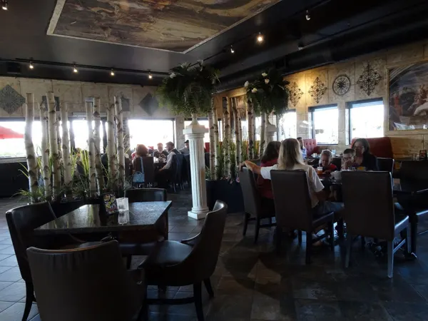 Waterdown family dining room at Symposium Cafe with spacious seating, warm décor and a relaxed atmosphere.