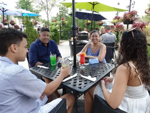 Weekend brunch on the Symposium Cafe patio with relaxed outdoor dining and full table service.
