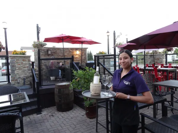 Celebration dining on the Symposium Cafe patio with comfortable seating for groups and special occasions.