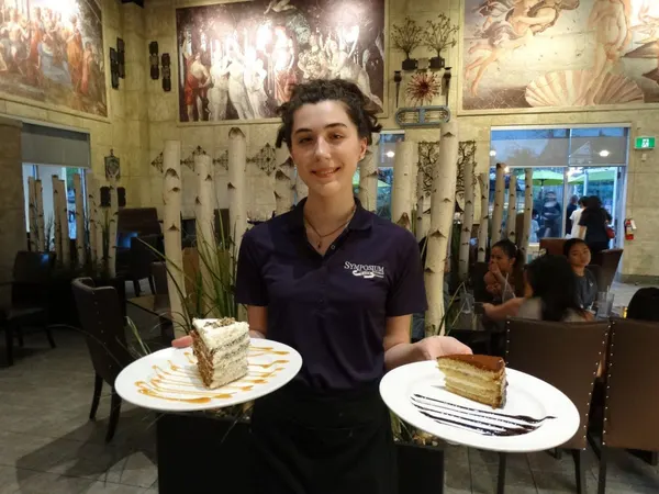 Date-night dessert at Symposium Cafe with an indulgent sweet presentation in a warm dining atmosphere.