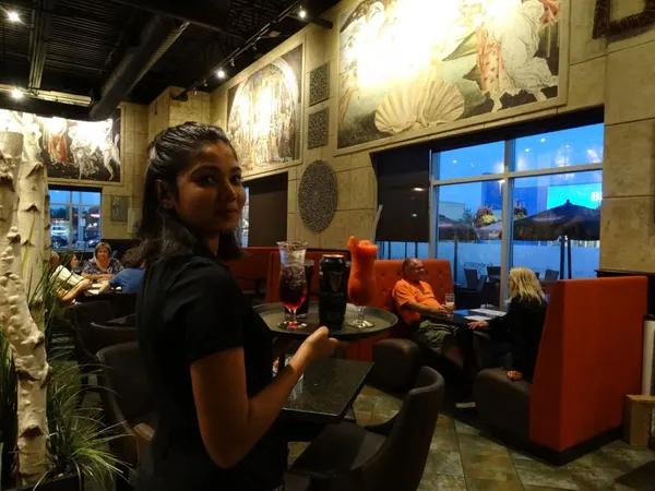 Refreshing smoothies served with welcoming service inside a stylish Symposium Cafe restaurant.