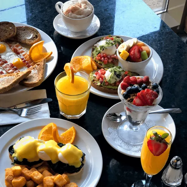 Oakville breakfast and brunch spread with eggs, bacon, golden home fries, fresh fruit and specialty drinks.