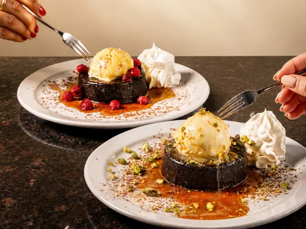 Chocolate Dubai Raspberry Lava Cake with ice cream at Symposium Cafe Restaurant Oakville