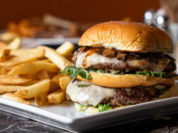 Thornhill burgers for lunch, with a juicy double cheeseburger, sautéed mushrooms and fries at Symposium Cafe Restaurant