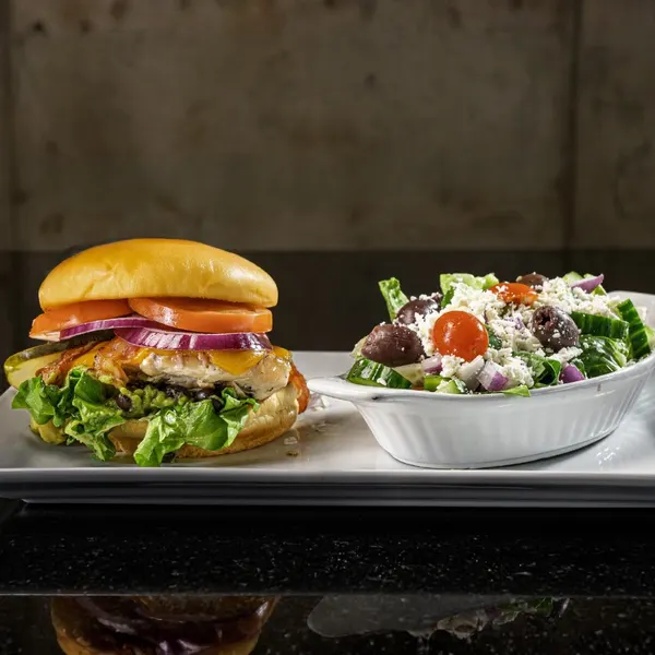 best lunch spot chicken sandwich and greek salad entree combo at symposium restaurant in Waterloo Ontario