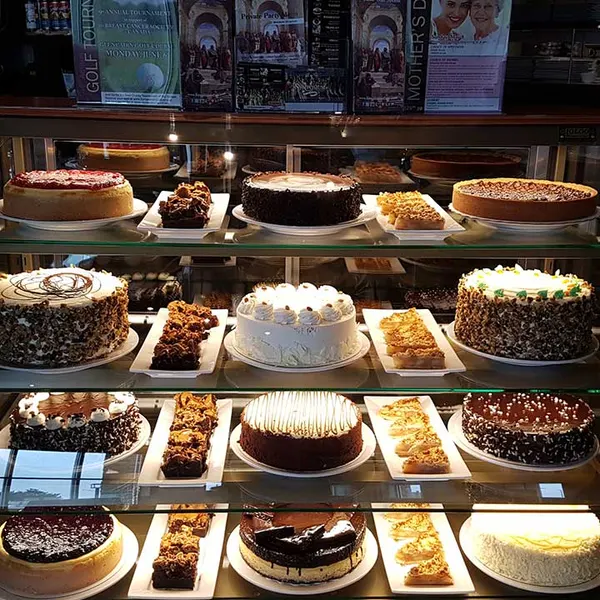 A top-rated dessert spot with an assorted specialty cake display at Westside Marketplace in Waterloo Ontario.