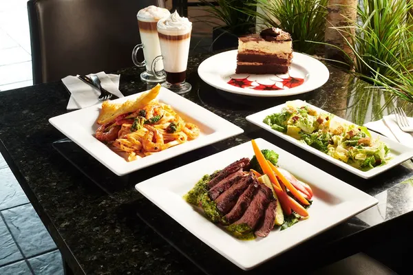 Best dinner restaurant in Waterloo Ontario serving steak, pasta, salads and desserts at Symposium Cafe Restaurant