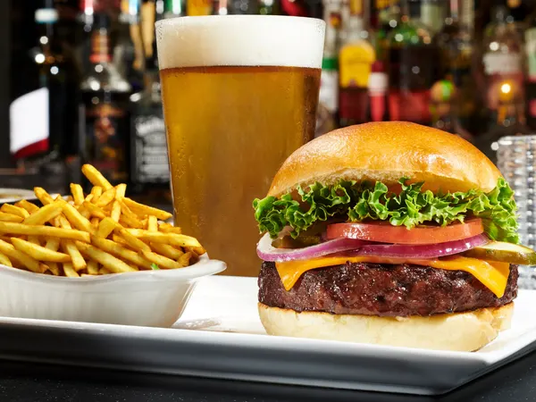 Bolton Ontario lunch spot serving gourmet burger with fries and beer at Symposium Cafe Restaurant