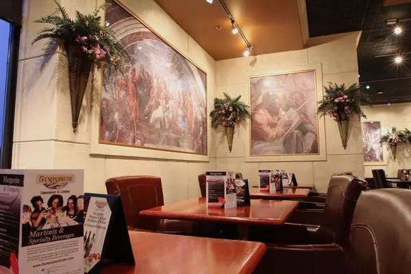 Cozy dining room at Symposium Cafe Restaurant in Bolton Ontario with comfortable seating and warm upscale-casual atmosphere