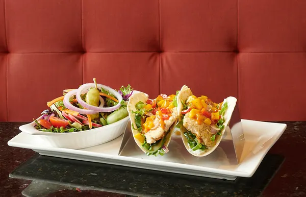 Lunch restaurant in Bolton Ontario featuring fish tacos with fresh salad at Symposium Cafe