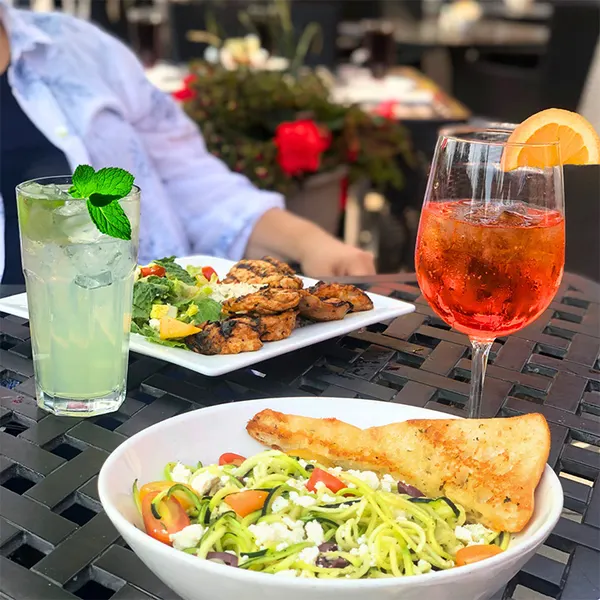 Bolton Ontario restaurant patio dining with fresh pasta, grilled chicken salad and refreshing cocktails at Symposium Cafe