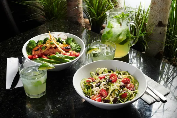 Bolton Ontario restaurant with seafood and vegetarian dinner choices including salmon salad and zucchini noodles at Symposium Cafe