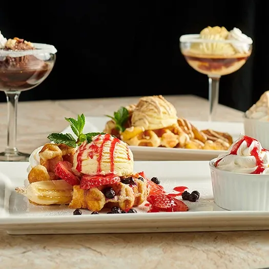 Symposium Cafe Restaurant gourmet dessert menu featuring cakes, croffles, waffles, affogatos and ice cream.