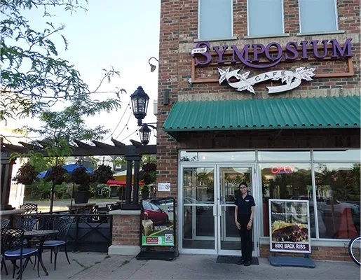 Symposium Cafe restaurant exterior and seasonal patio with comfortable outdoor dining across Ontario.